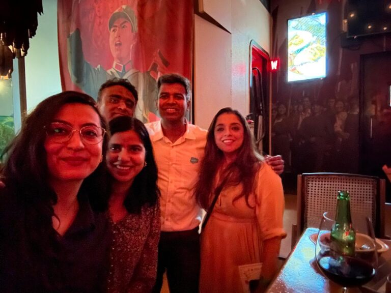 Neha and her colleagues at the event Last Day of FY 25 Celebration.
