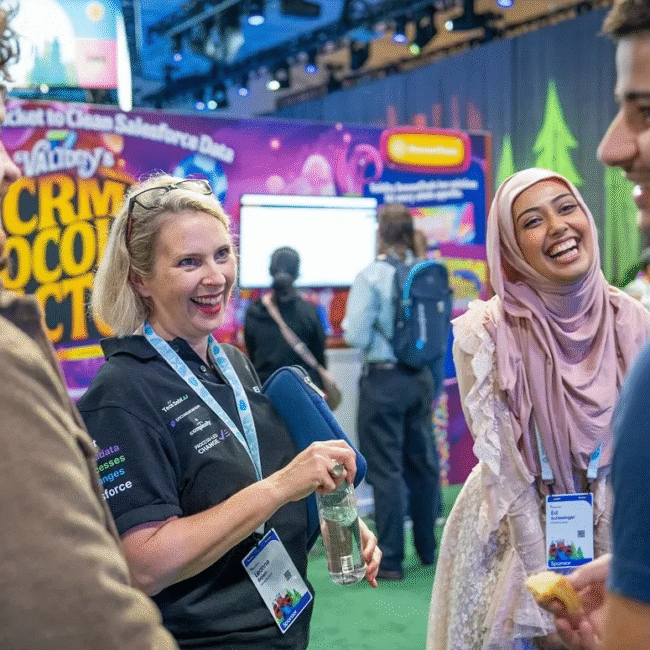Attendees at Dreamforce sharing a moment of connection for networking small businesses.